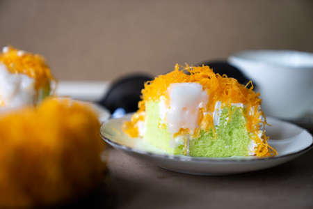 close up selective focus piece of  Gold Egg Yolk Thread Cake , or  'Cake Foi Tong