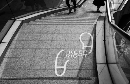 "Keep Right" word and sign on the stairs of fly over bridge, black and whiteの写真素材