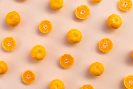 top view pattern Background of whole and half oranges on orange backgroundの写真素材
