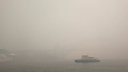 invisible Sydney harbor bridge in the smoke haze, from bush fire in NSW, caused Sydney's air quality plummet.  Australia :10-12-2019のeditorial素材
