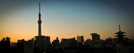 A small amusement park in the urban city of tokyo in the morningのeditorial素材