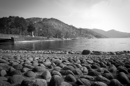 Lake Chuzenji in the afternoon with blue sky in black and whiteの写真素材