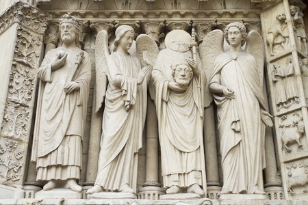 St. Denis Decapitated Seen at the left hand side of the main entrance to Notre Dame Cathedral.のeditorial素材