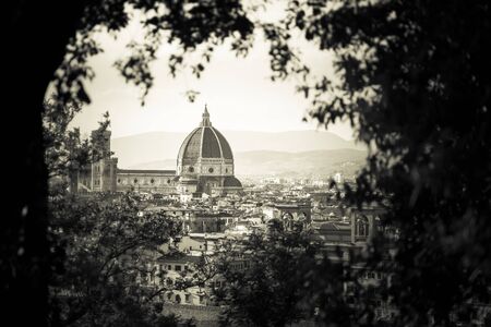 Duomo view through the trees on Piazzale Michelangelo. Florence, Italy. Postcard for travelersの写真素材