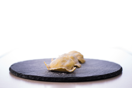Three homemade italian ravioli isolated on white background. Fresh pastaの写真素材