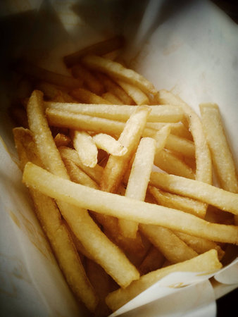 Fried potatoes in the paper box