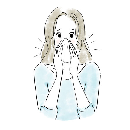 Women suffering from runny nose due to hay fever, colds, and rhinitisの写真素材