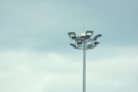 Ground light pole on cloudy sky backgroundの写真素材