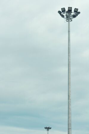 Ground light pole on cloudy sky backgroundの写真素材