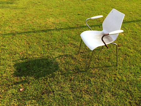 Chair in green meadowの写真素材