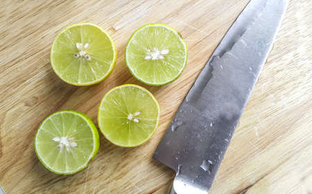 Cut lemon with knifeの写真素材
