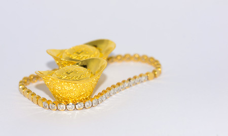 Chinese gold ingots isolated on white backgroundの写真素材