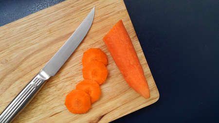 Sliced vegetables on a cutting board with knife