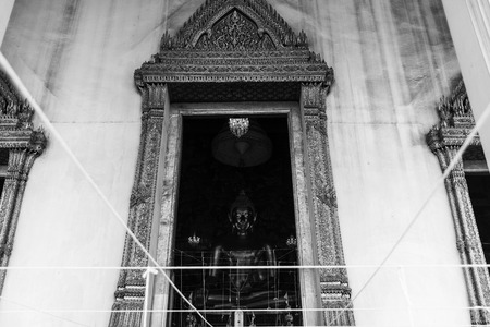 Golden buddha statue in monotoneの写真素材