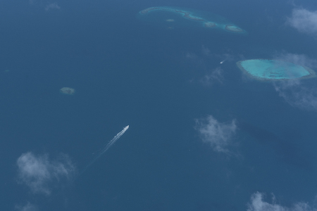 Bird eye view of blue sea and island in Maldives