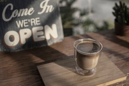 Hot latte layer coffee on small shot glass