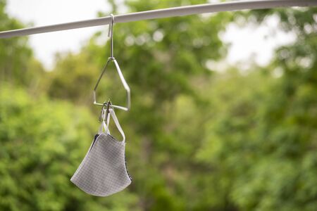 Fabric face mask prevent for Covid-19 virus and PM 2.5. Disease protection, Social distance campaign for health defection protection. Cloth face mask.の写真素材