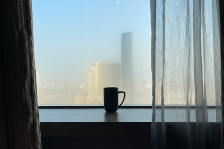 Glass shape of coffee cup with foggy window theme with morning light