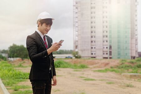 Construction Engineer Checking Plan On Building Site.の写真素材