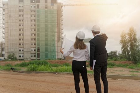 Construction Engineer Checking Plan On Building Site.の写真素材
