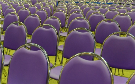 Image of conference hall with empty violet seats and yellow floorの写真素材