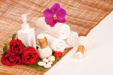 Spa and wellness setting with natural soap, candles and towelの写真素材