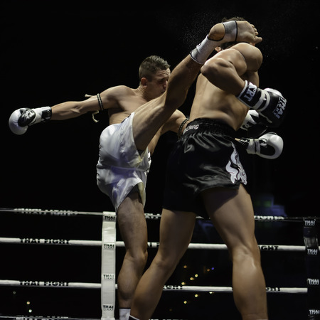 SATTAHIP, THAILAND- APRIL 6 : Between the punch  in Thai Fight : Muay Thai..World's  between Antoine Pinto (France) VS Alan Ryan (Scotland) in Thai Fight : Muay Thai..World's Unrivalled Fight on April 6, 2014 at King of muay thai , Chonburi , Thailandのeditorial素材