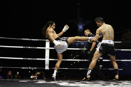 SATTAHIP, THAILAND- APRIL 6 : Between the punch  in Thai Fight : Muay Thai..World's  between Sudsakorn Sor.Klinmee (thailand) VS Cody Moberly (canada) in Thai Fight : Muay Thai..World's Unrivalled Fight on April 6, 2014 at King of muay thai , Chonburi , Tのeditorial素材