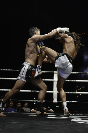 SATTAHIP, THAILAND- APRIL 6 : Between the punch  in Thai Fight : Muay Thai..World's  between Sudsakorn Sor.Klinmee (thailand) VS Cody Moberly (canada) in Thai Fight : Muay Thai..World's Unrivalled Fight on April 6, 2014 at King of muay thai , Chonburi , Tのeditorial素材