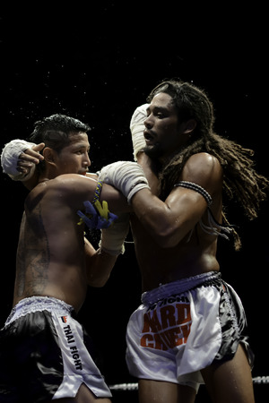 SATTAHIP, THAILAND- APRIL 6 : Between the punch  in Thai Fight : Muay Thai..World's  between Sudsakorn Sor.Klinmee (thailand) VS Cody Moberly (canada) in Thai Fight : Muay Thai..World's Unrivalled Fight on April 6, 2014 at King of muay thai , Chonburi , Tのeditorial素材