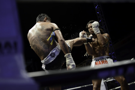 SATTAHIP, THAILAND- APRIL 6 : Between the punch  in Thai Fight : Muay Thai..World's  between Sudsakorn Sor.Klinmee (thailand) VS Cody Moberly (canada) in Thai Fight : Muay Thai..World's Unrivalled Fight on April 6, 2014 at King of muay thai , Chonburi , Tのeditorial素材