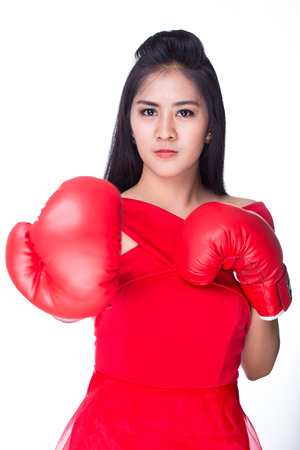 Woman wearing a red dress with red gloves.の写真素材