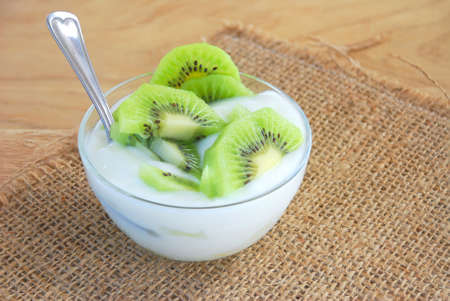 yogurt without sugar and slice kiwi in concept food for health and beautyの写真素材