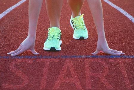 young women prepare for start in competition