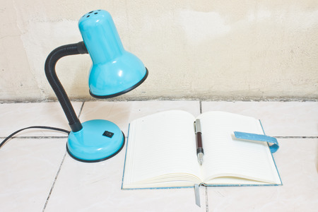 blue lamp and blue bookの写真素材
