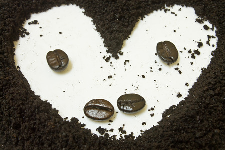 Coffee grounds and coffee bean, heart shapeの写真素材