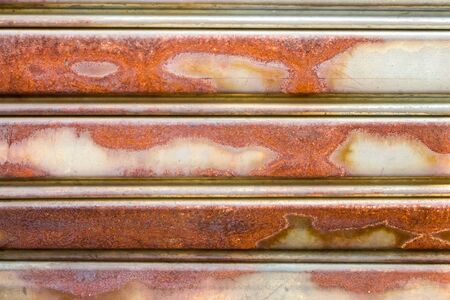 roller shutter door, rusty metal backgroundの写真素材