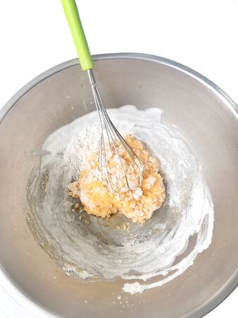 Cake mixture in stainless bowl before bakingの写真素材