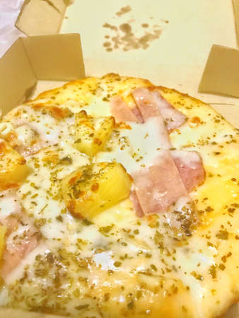 small pizza in a cardboard boxの写真素材