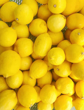 Many Ripe Yellow Lemons Background.の写真素材