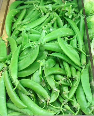 Fresh green pea pods in piled.の写真素材