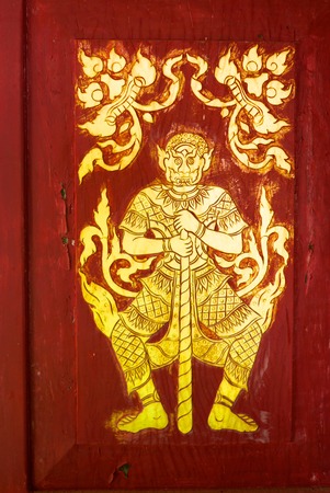 the detail of  thai gold painting pattern on ancient temple door,shallow focus,Lampang temple,Thailandの写真素材
