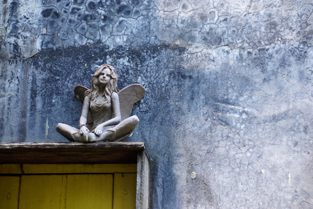 angel sculpture at the corner of gardenの写真素材