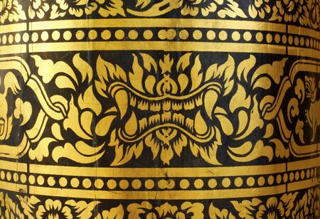 detail of thai pattern that made by covered wood plate with gold leaf for decorated temple door or pillar,shallow focusの写真素材