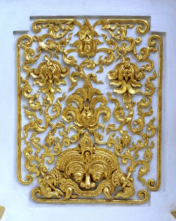 stucco work in thai art that usually decorated with mirror and precious stone or gold leaf,Chiang rai temple,Thailandの写真素材