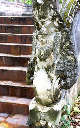 angel figure at buddhist temple,Chiangrai,Thailandの写真素材