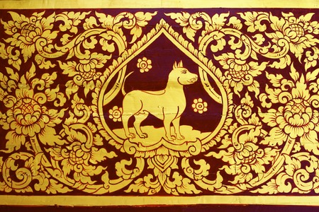 detail of thai pattern that made by covered wood plate with gold leaf for decorated temple door or pillar,shallow focusの写真素材