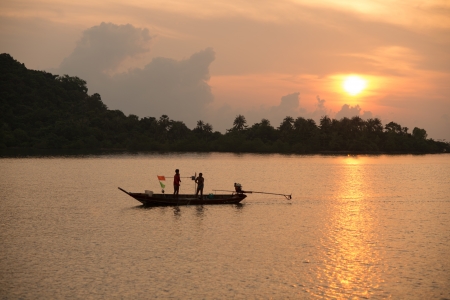 sunrise and fishermanの写真素材