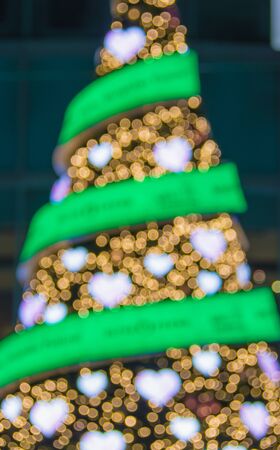 Defocused christmas tree lights. Heart shaped bokehの写真素材