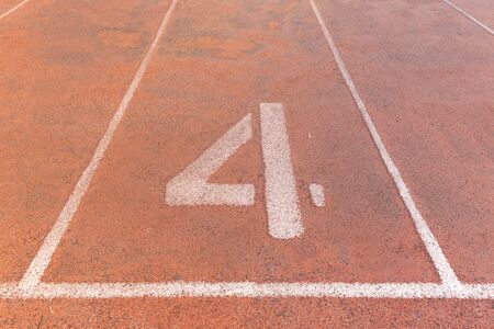 Start track. Lanes 4, number four of a red racing track.の写真素材